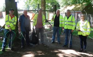 Members of the club and friends clearing litter